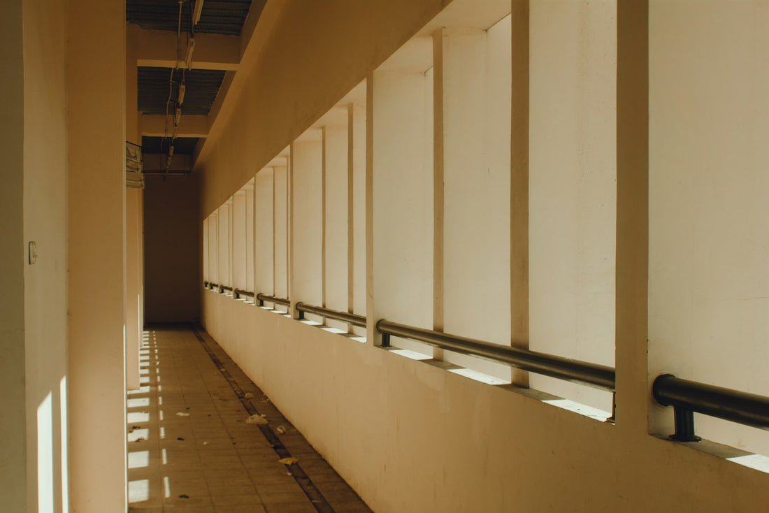 Sunlight streaming down a long empty hallway