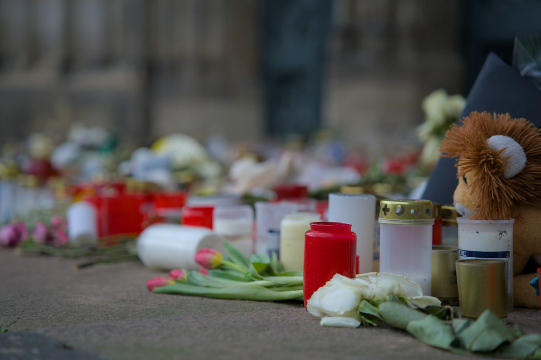 Candles and flowers arranged as a quiet memorial