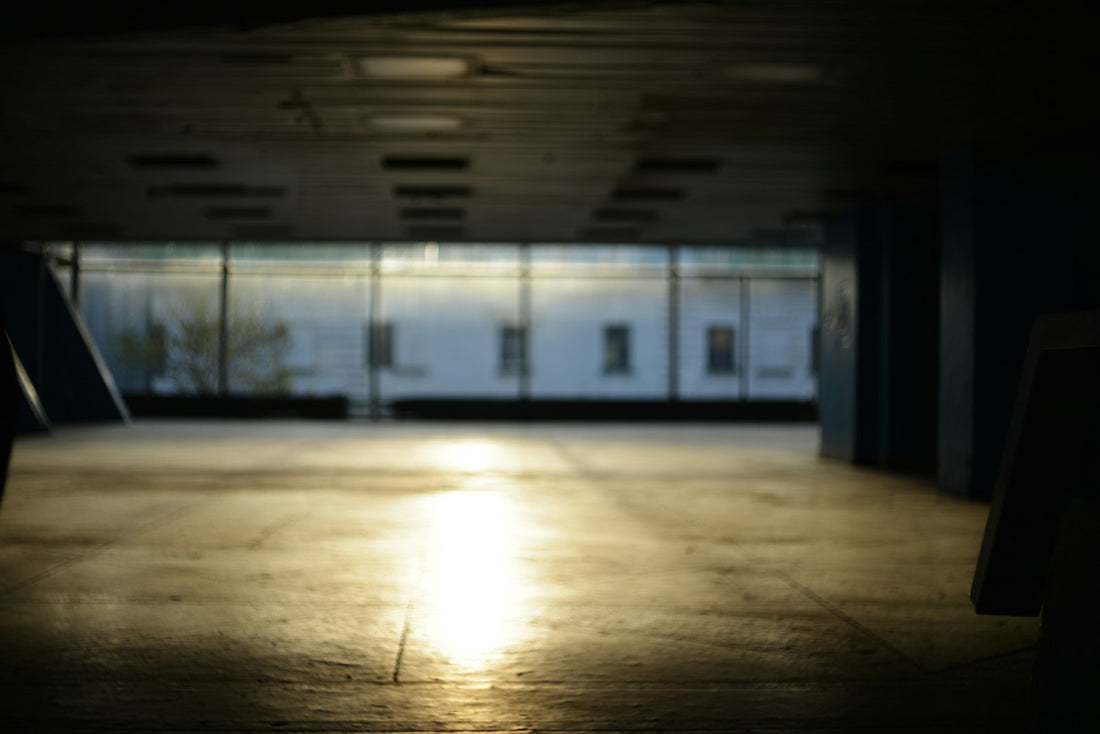 Sunlight reflecting on a concrete floor indoors