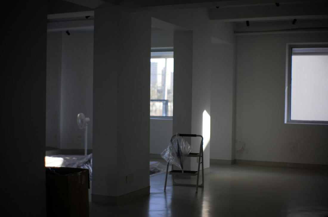 Sunlight streaming through a window into an empty room