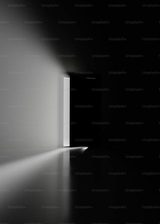 Light falling into a quiet dark room through a doorway
