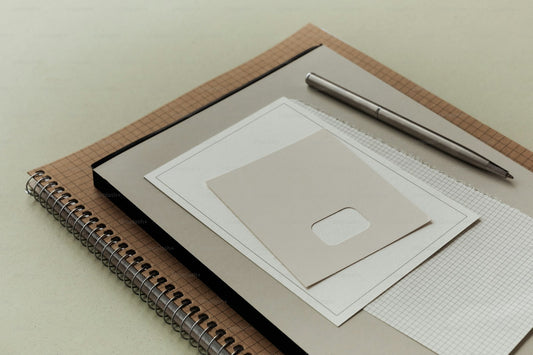 Blank notebook and pencil on a clean desk